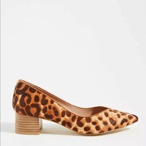 Anthropologie stacked animal print heels.